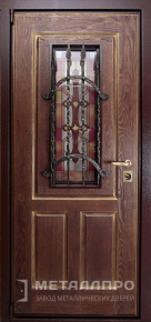 Фото №2 «Входная дверь со стеклом и ковкой в коттедж»