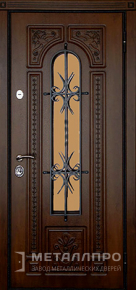 Фото №1 «Входная дверь в частный дом с отделкой МДФ ковкой и стеклом»